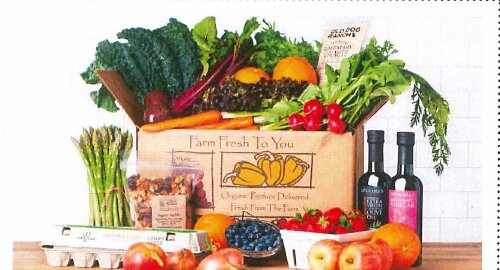 A Farm Fresh To You box of organic produce, eggs and olive oil